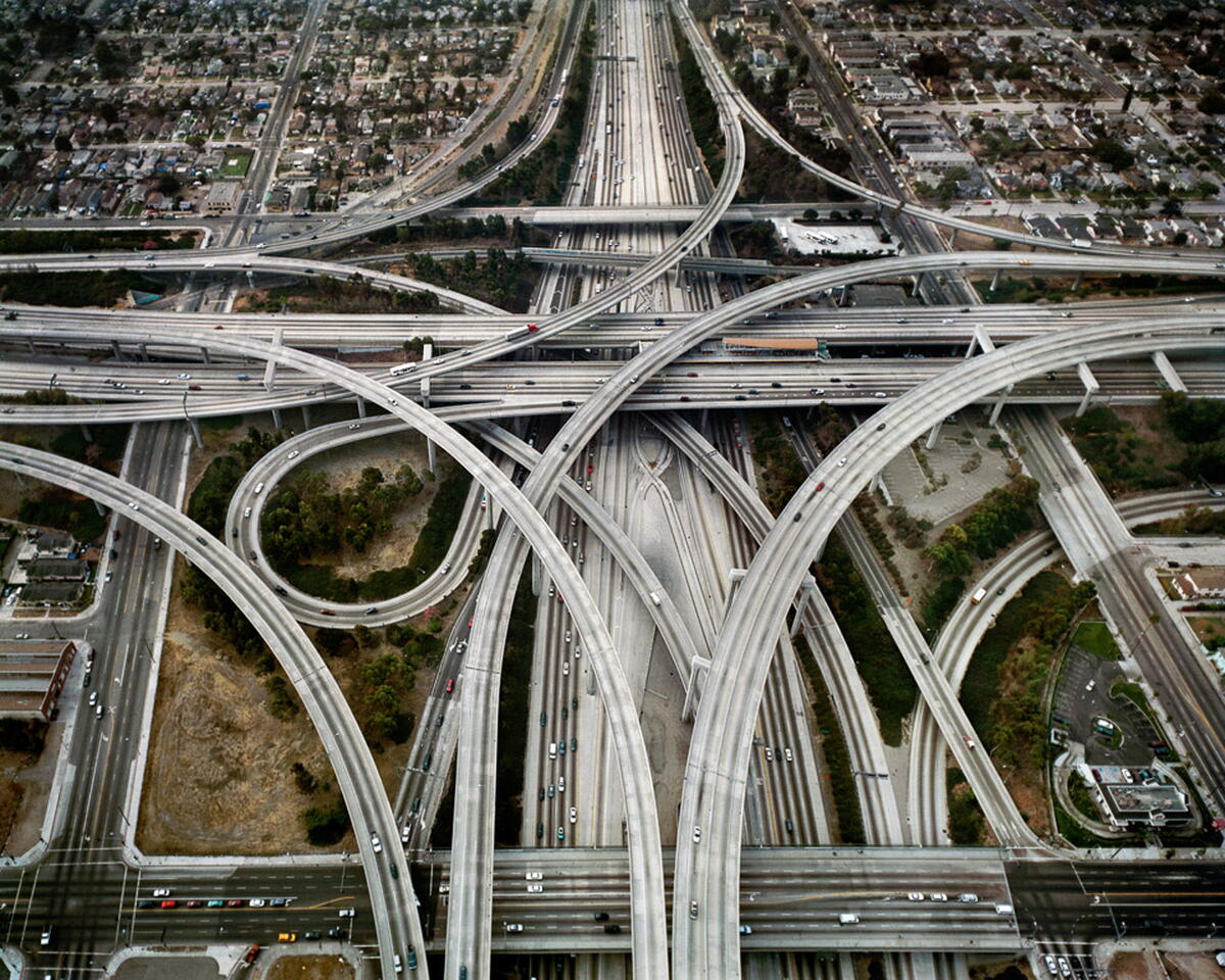 Highway interchange from above, highlighting how much space is taken by roadways