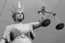 Black and white photo of scales of justice