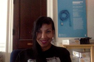 Grad Student Lettycia Terrones sits in an office and smiles at the camera