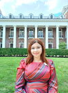 Profile photo of Camellia Paul standing in front of the English Building on the Main Quad at the University of Illinois Urbana-Champaign