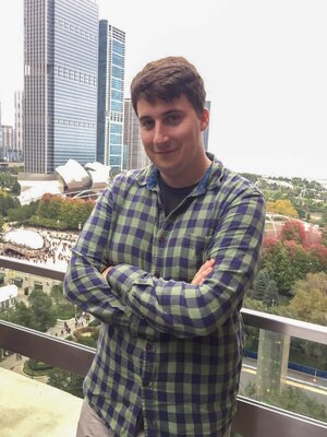 Grad student Arkaitz Ibarretxe Diego stands outside with crossed arms and smiles at the camera.