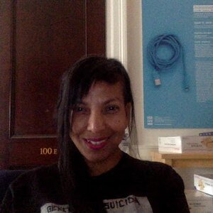Grad Student Lettycia Terrones sits in an office and smiles at the camera