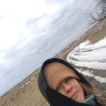 Grad Student Lila Ann Dodge stands outdoors in winter and looks to the camera.